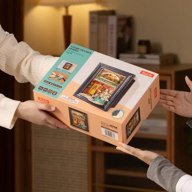 Rolife Old Times Bookstore DP004 gift box being handed over as a DIY wooden puzzle present