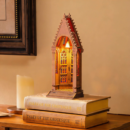 Rolife Geometric Cathedral TGA03 displayed as a glowing cathedral night light on books
