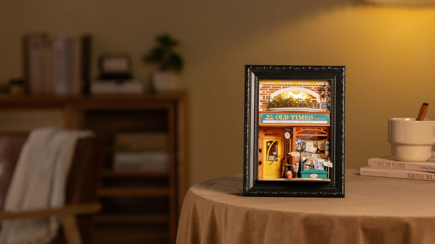 Rolife Old Times Bookstore DP004 illuminated story frame displayed on a warm tabletop scene
