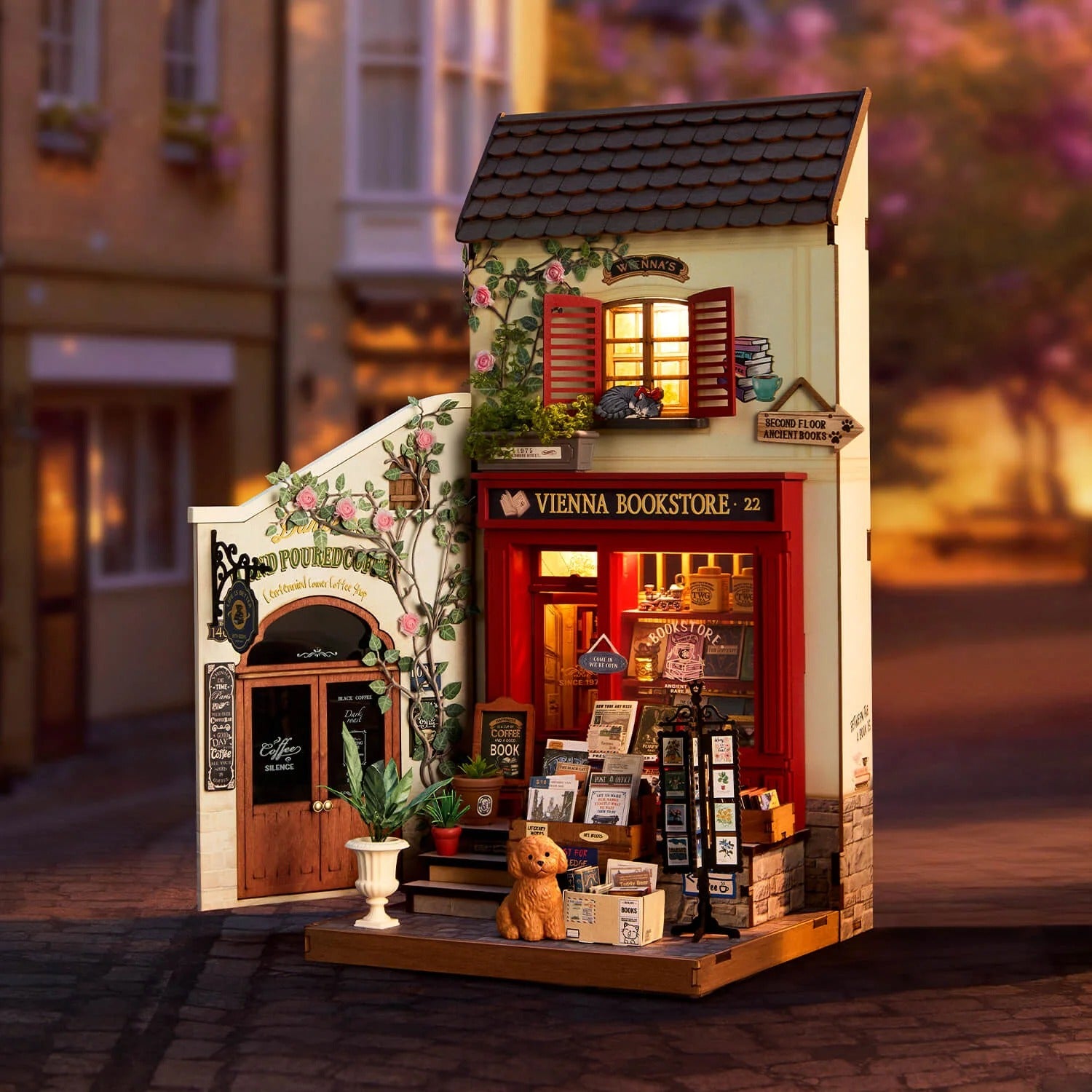 Rolife Vienna Bookstore DG183 displayed with warm LED lighting in a cozy miniature street scene