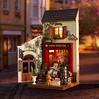 Rolife Vienna Bookstore DG183 displayed with warm LED lighting in a cozy miniature street scene
