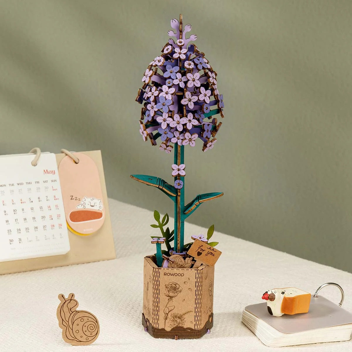 Rowood Lilac TW021 wooden flower displayed as home decor on a desk or shelf