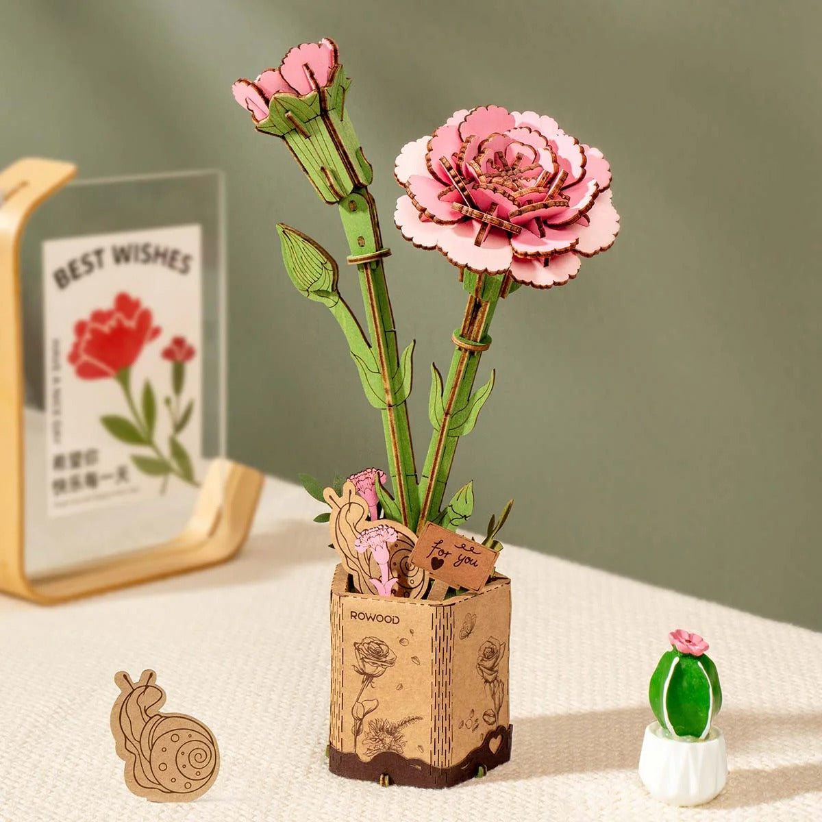 Rowood Pink Carnation TW051 wooden flower puzzle displayed in a home decor scene