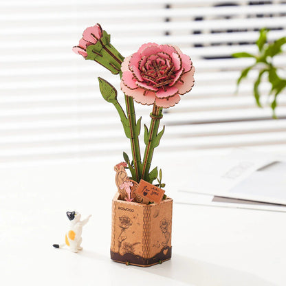 Rowood Pink Carnation TW051 DIY wooden flower puzzle as desk decor near a window