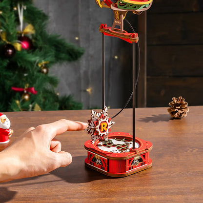 ROKR Santa on Sleigh MCD05 pendulum base close-up showing snowflake counterweight motion