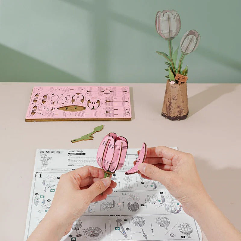 Rowood Pink Tulip TW082 assembly demonstration with pre-cut wooden flower parts and instruction manual