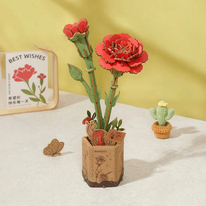 Rowood Red Carnation TW052 displayed as a long-lasting wooden flower decoration on a tabletop.