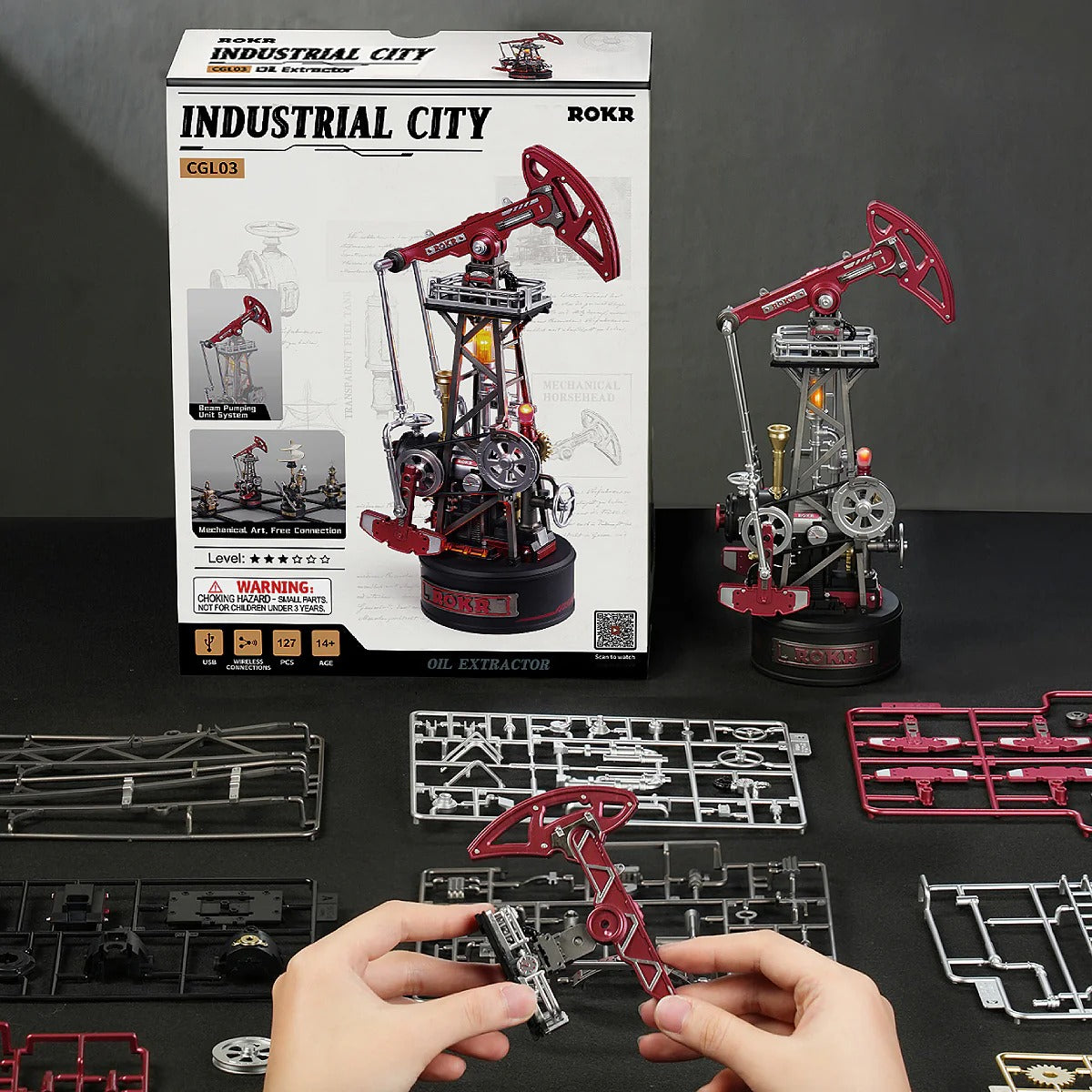 ROKR Oil Pump Jack CGL03 kit box, pre-cut parts, and partially assembled pumpjack model display