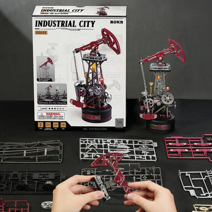 ROKR Oil Pump Jack CGL03 kit box, pre-cut parts, and partially assembled pumpjack model display