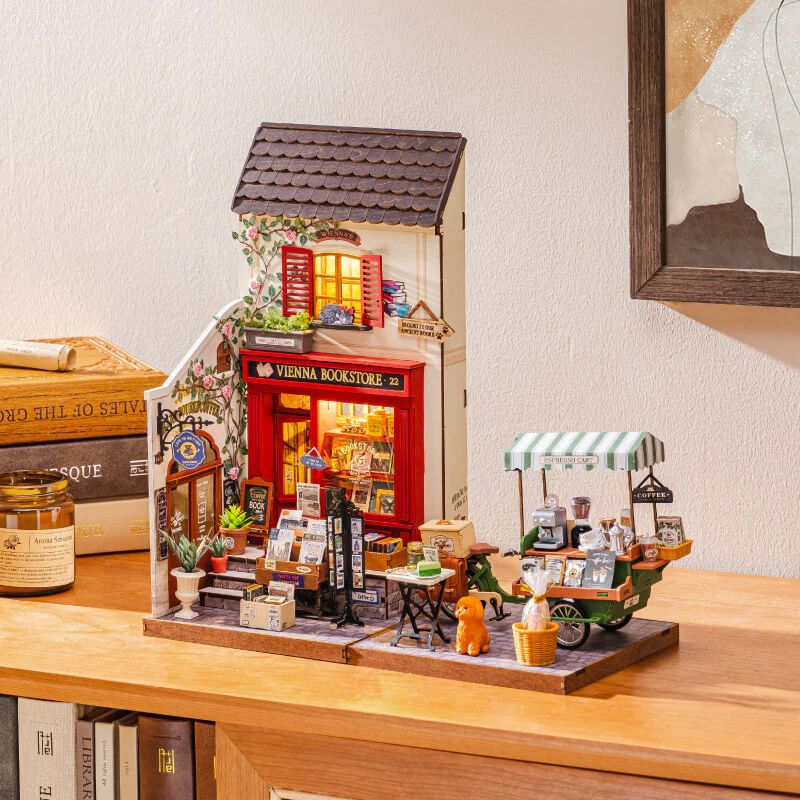 Rolife Aromatic Coffee Cart DG182 and Vienna Bookstore miniature houses in an angled display scene