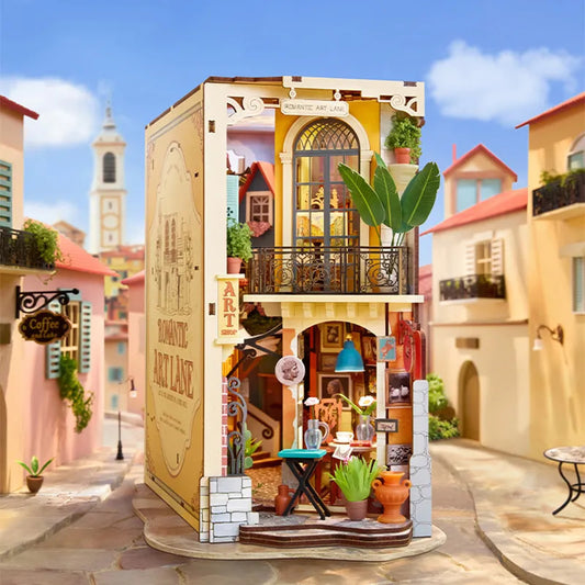 Rolife Romantic Art Lane TGB20 - completed book nook displayed against a European street scene