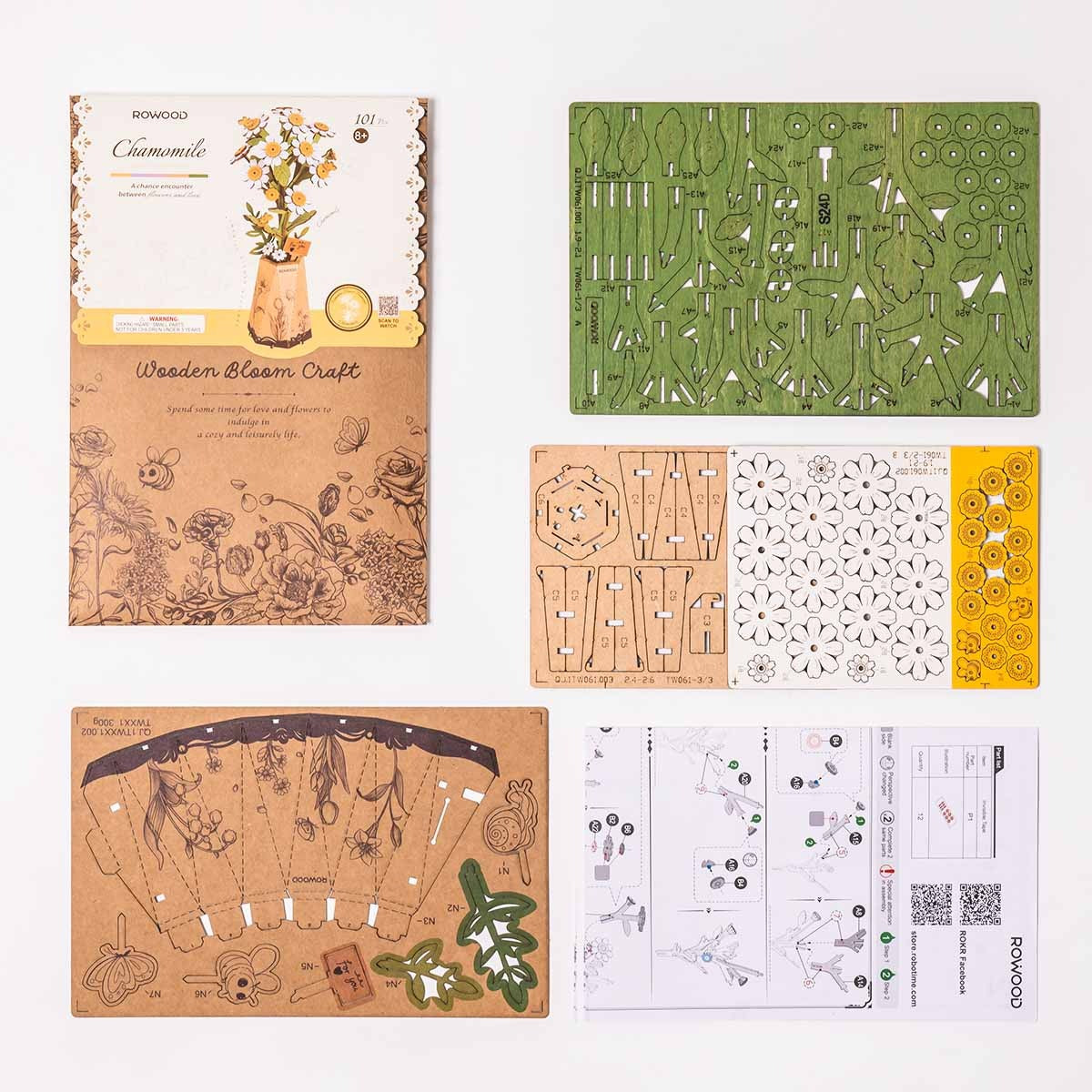 Rowood Chamomile TW061 kit contents with pre-cut wooden flower pieces, paper flower pot parts and instruction manual