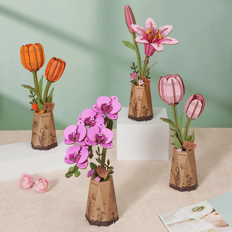 Rowood Pink Tulip TW082 shown with orange tulip, lily and orchid wooden flower kits in a collection display