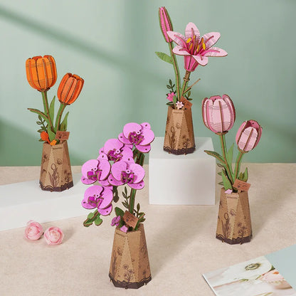 Rowood Pink Tulip TW082 shown with orange tulip, lily and orchid wooden flower kits in a collection display