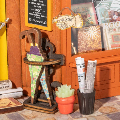 Close-up of Rolife Old Times Bookstore DP004 antique umbrella stand, newspaper bin and welcome sign details