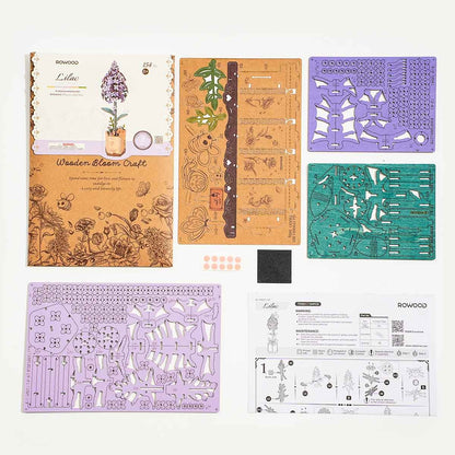 Rowood Lilac TW021 kit contents with pre-cut wooden sheets, flower pieces and instruction manual