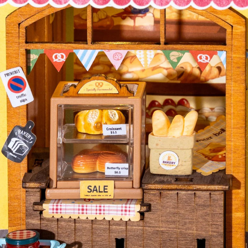 Rolife Fluffy Cat Bakery DP001 close-up of pastry counter with croissants, baguettes and sale display