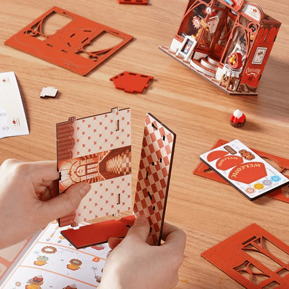 Rolife Sweet Chocolate Shop DS046 assembly process with pre-cut parts and instruction manual on table