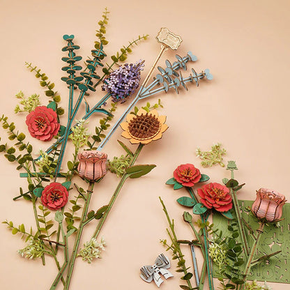 Rowood Wooden Bloom Box TW02H flat lay showing wooden flowers, greenery stems and decorative components before arrangement