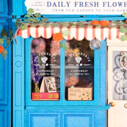 Rolife Daily Fresh Flower DP003 close-up of blue flower shop window, striped awning, vines and hanging light
