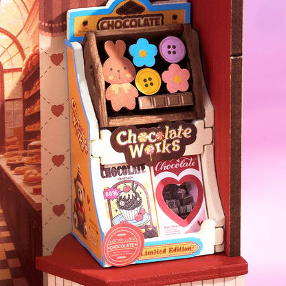 Rolife Sweet Chocolate Shop DS046 close-up of Chocolate Works miniature shelf with bunny and flower chocolates