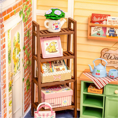 Close-up of the Sunshine Sip Porch DWS07B wooden garden shelf with books, basket and miniature decor.