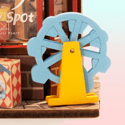 Detailed close-up of the blue Ferris wheel accessory on Rolife Whimsy Toy Shop DS044.