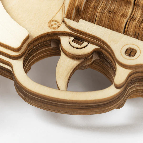 Close-up of a wooden puzzle with intricate design on a white background