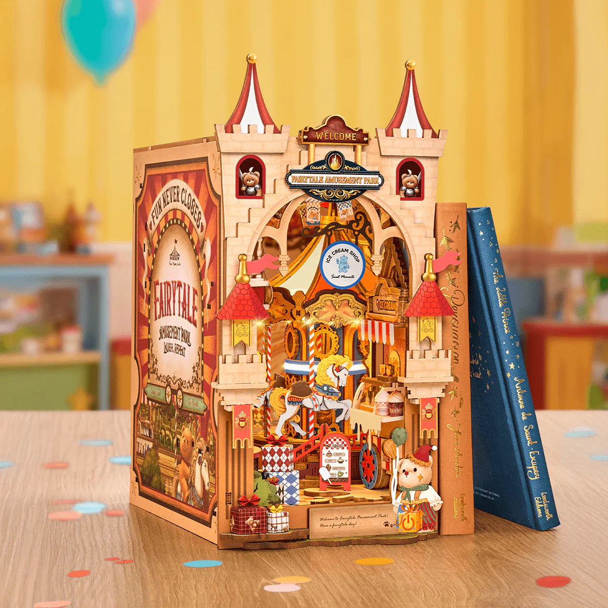 Rolife Tipsy Restaurant TGB17 DIY Miniature House Kit displayed with books and warm LED lights